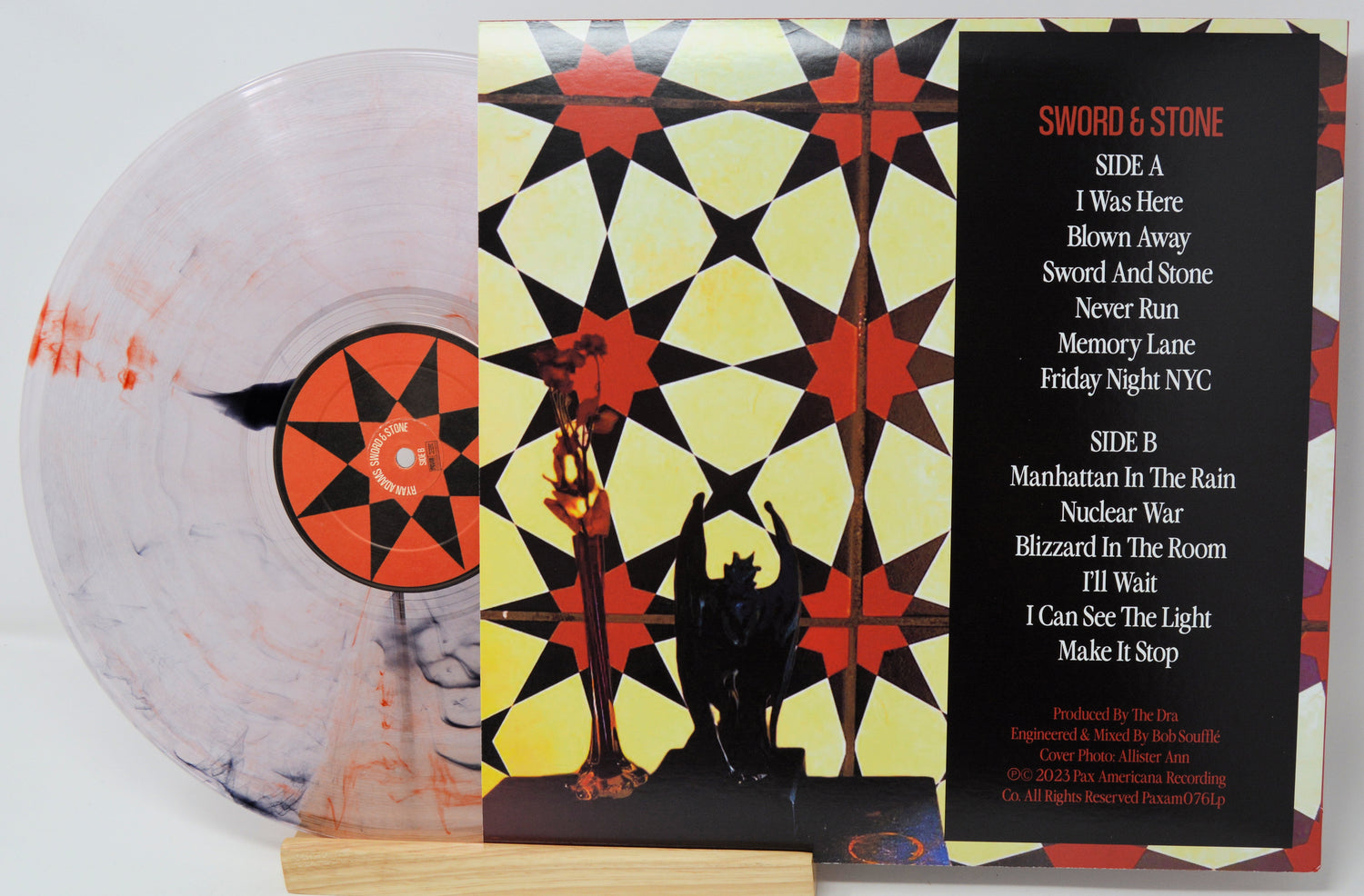 Vinyl record with colorful cover and white background