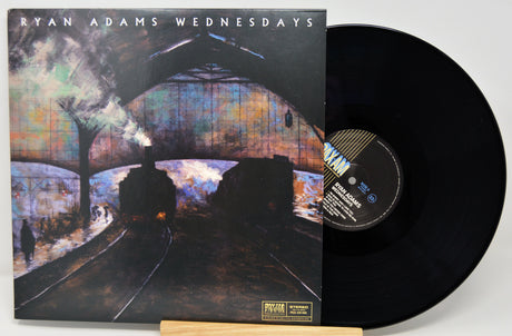 Vinyl record with cover featuring a train under a bridge, titled 'Ryan Adams Wednesdays'.