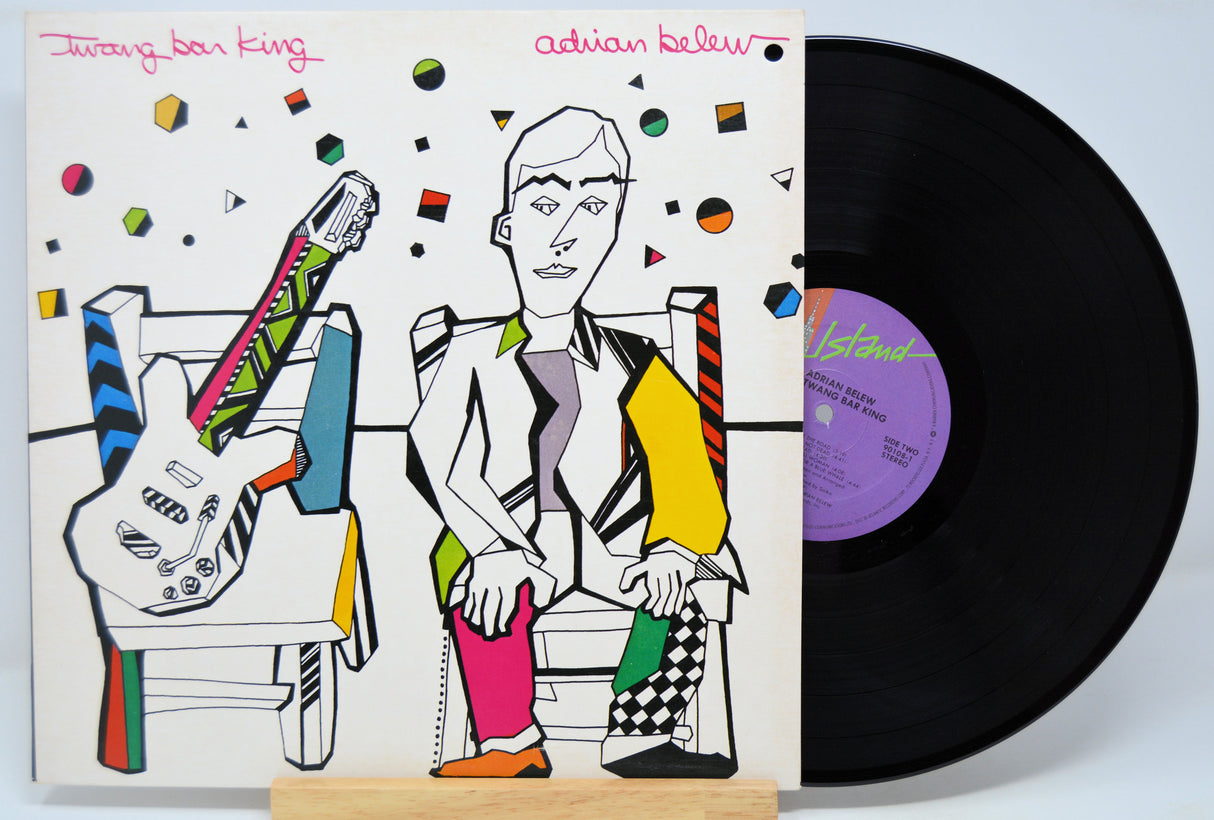Vinyl record 'Adrian Belew Twang Bar King' with a colorful cover featuring a stylized illustration of a person and guitar, on a white background.