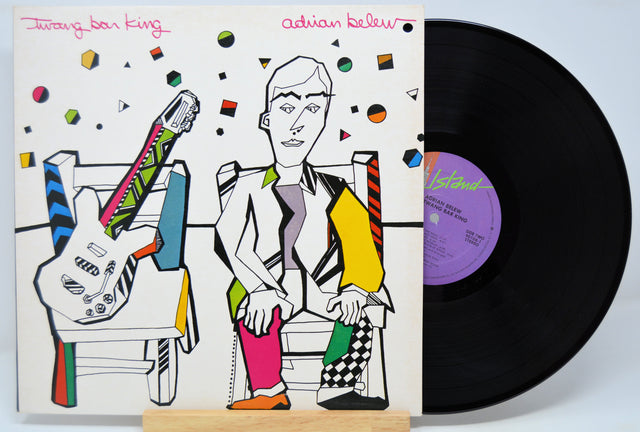 Vinyl record 'Adrian Belew Twang Bar King' with a colorful cover featuring a stylized illustration of a person and guitar, on a white background.