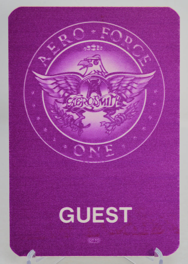 Aerosmith purple 'Aero Force One' guest pass with eagle emblem on a white background