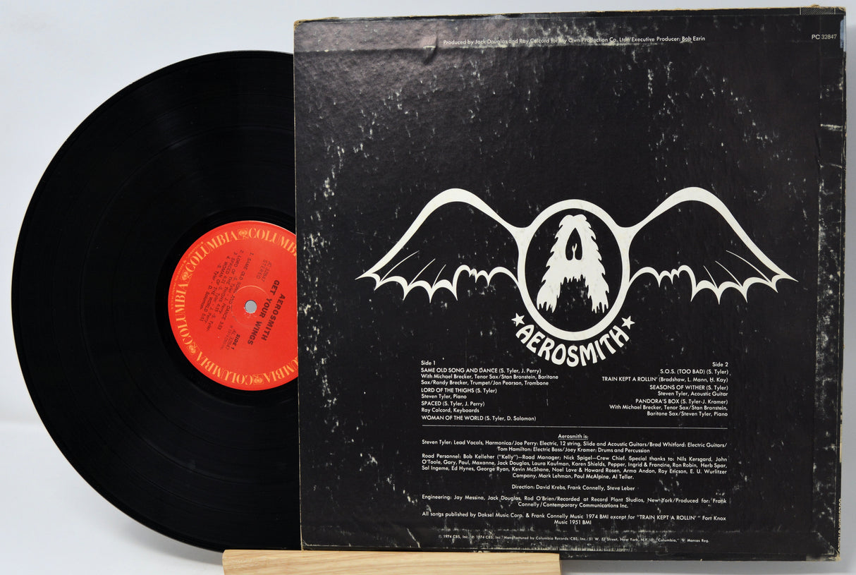 Vinyl record with Aerosmith album cover on a white background