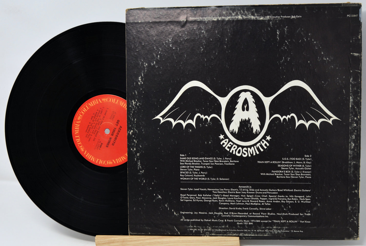 Vinyl record with Aerosmith album cover on a white background