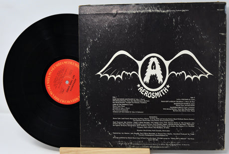 Vinyl record with Aerosmith album cover on a white background