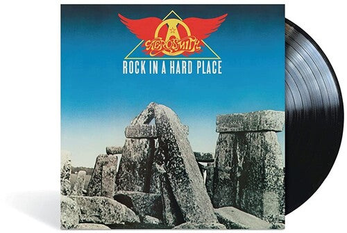 Vinyl record with 'Iron Maiden' album cover featuring Stonehenge and the band's logo.