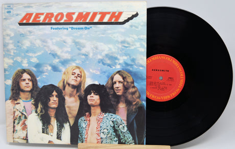 Vinyl record and cover of Aerosmith album with band members on cover