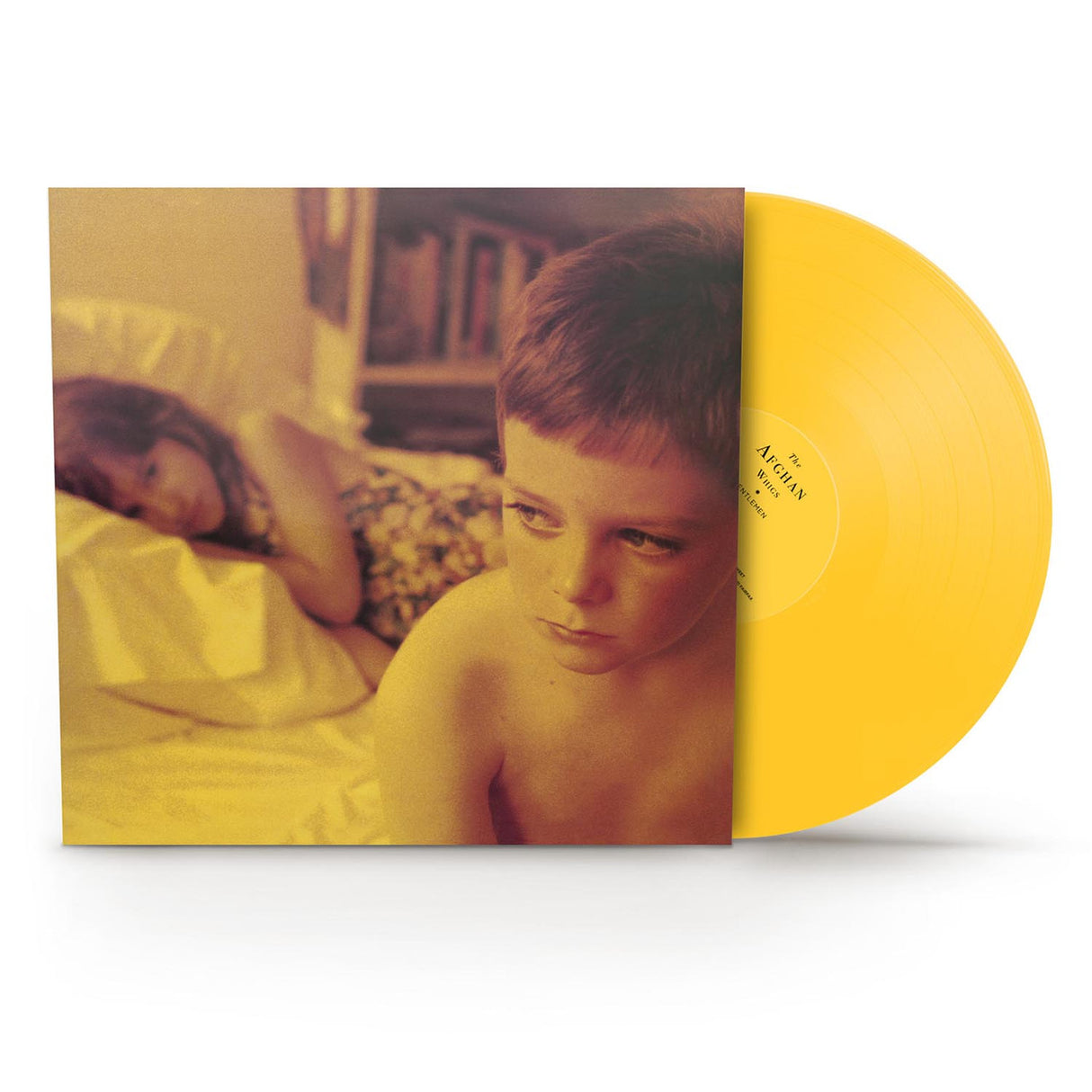 Vinyl record with a yellow cover featuring a child and a dog, on a white background.