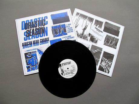 Vinyl record with 'Drastic Season' and 'African Head Charge' on a gray background