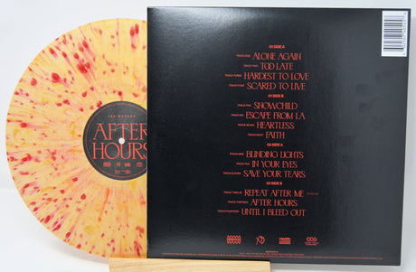 Yellow and red splatter After Hours vinyl LP partially covered by the album’s tracklist on black sleeve