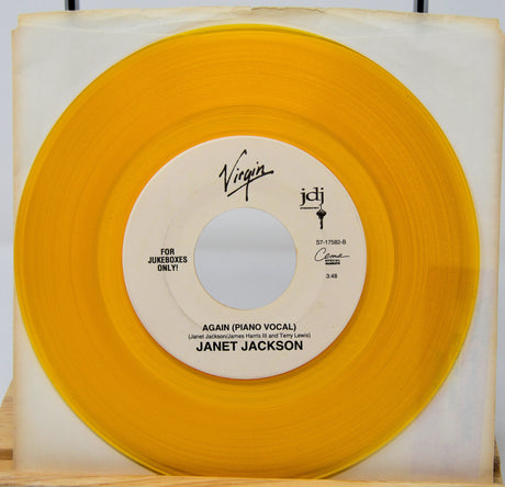 Janet Jackson Again yellow vinyl record jukebox single with piano vocal side displayed