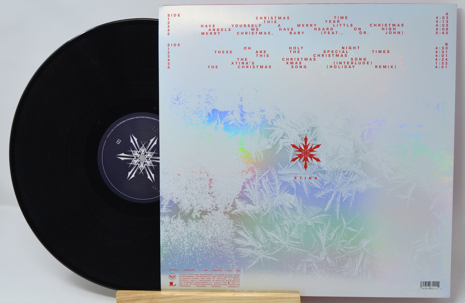 Vinyl record with a colorful cover featuring snowflake designs and text.