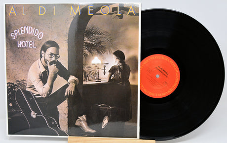Aldi Meola 'Splendido Hotel' vinyl record LP shown with the printed album cover on the left and the black record partially pulled out on the right, against a plain light background.