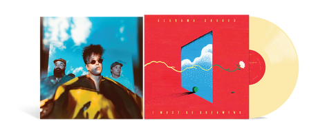 A vinyl record album shown open, with the left sleeve featuring a stylized portrait of a person against a blue sky, the center cover in bright red with a blue window illustration, and a pale yellow record partially visible on the right.