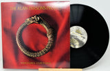 Vinyl record album 'Vulture Culture' by The Alan Parsons Project, showing the red cover with a coiled snake graphic and the black vinyl record partially pulled out.