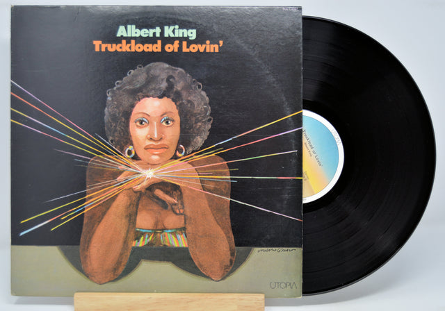 'Albert King, Truckload of Lovin' Vinyl record and front cover with drawing of a woman with a shiny ring.
