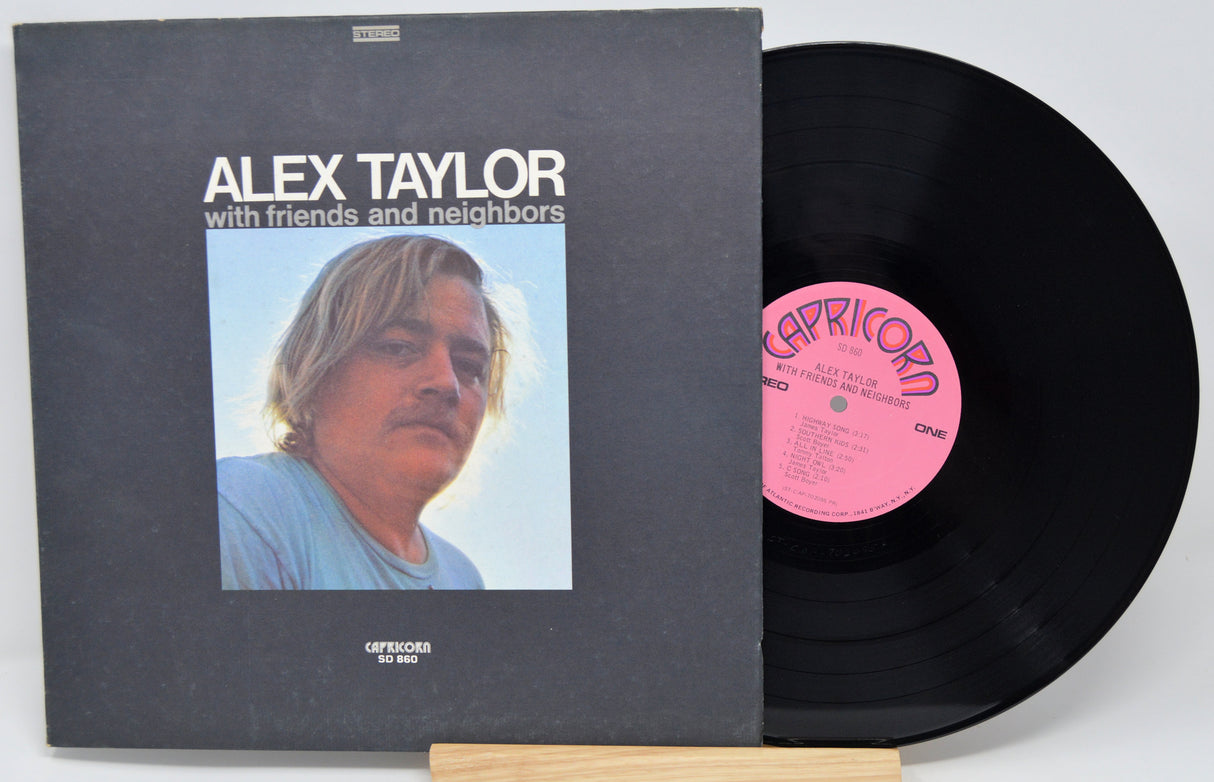 Vinyl record 'Alex Taylor - With Friends Neighbors' with front cover featuring a person and album details on a white background