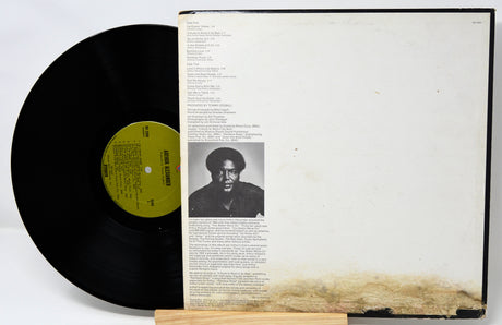 Vinyl record with a portrait on the cover against a white background