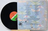 Vinyl record with colorful dragonfly design on the cover