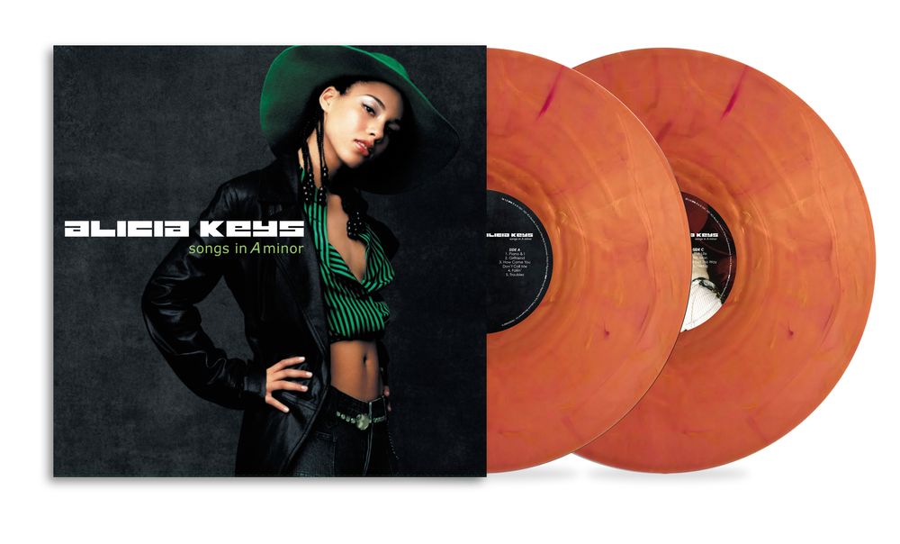 Vinyl record set with a cover featuring Alicia Keys wearing a green hat and black outfit.