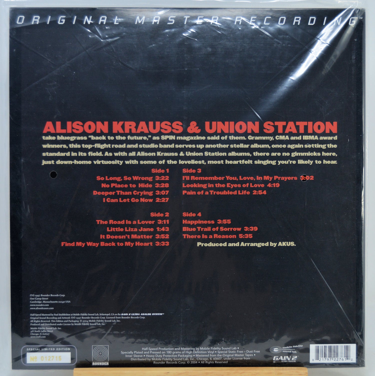 The back cover of the Alison Krauss & Union Station 'Original Master Recording' vinyl LP sleeve, showing track listings, credits on a black background.