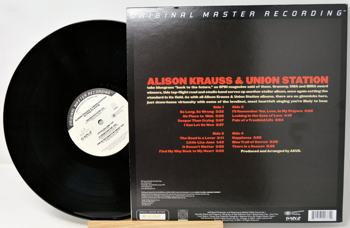Vinyl record album shown with the black LP partially visible beside the back cover of the record sleeve. The cover reads 'Original Master Recording' and 'Aislon Krauss & Union Station,' with track listing and release details on a white background.