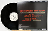 Vinyl record album shown with the black LP partially visible beside the back cover of the record sleeve. The cover reads 'Original Master Recording' and 'Aislon Krauss & Union Station,' with track listing and release details on a white background.