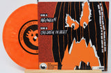 Vinyl record with orange disc and black and orange cover featuring a ghost design.