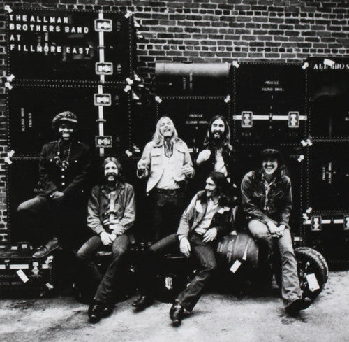 Allman Brothers 'At The Fillmore East' Vinyl record cover showing the band seeming happy in front of a stack of their sound equipment.