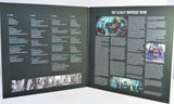 An open gatefold record cover spread titled 'THE ALLMAN BROTHERS BAND,' showing printed text columns, small photos, and a dark background.