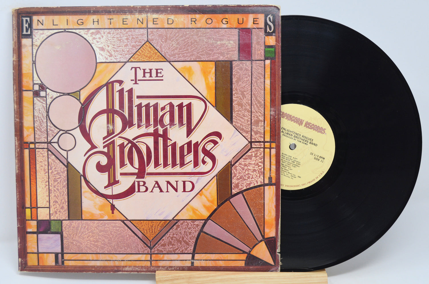 Used vinyl record of Allman Brothers, Enlightened Rogues, with album cover and band name visible.