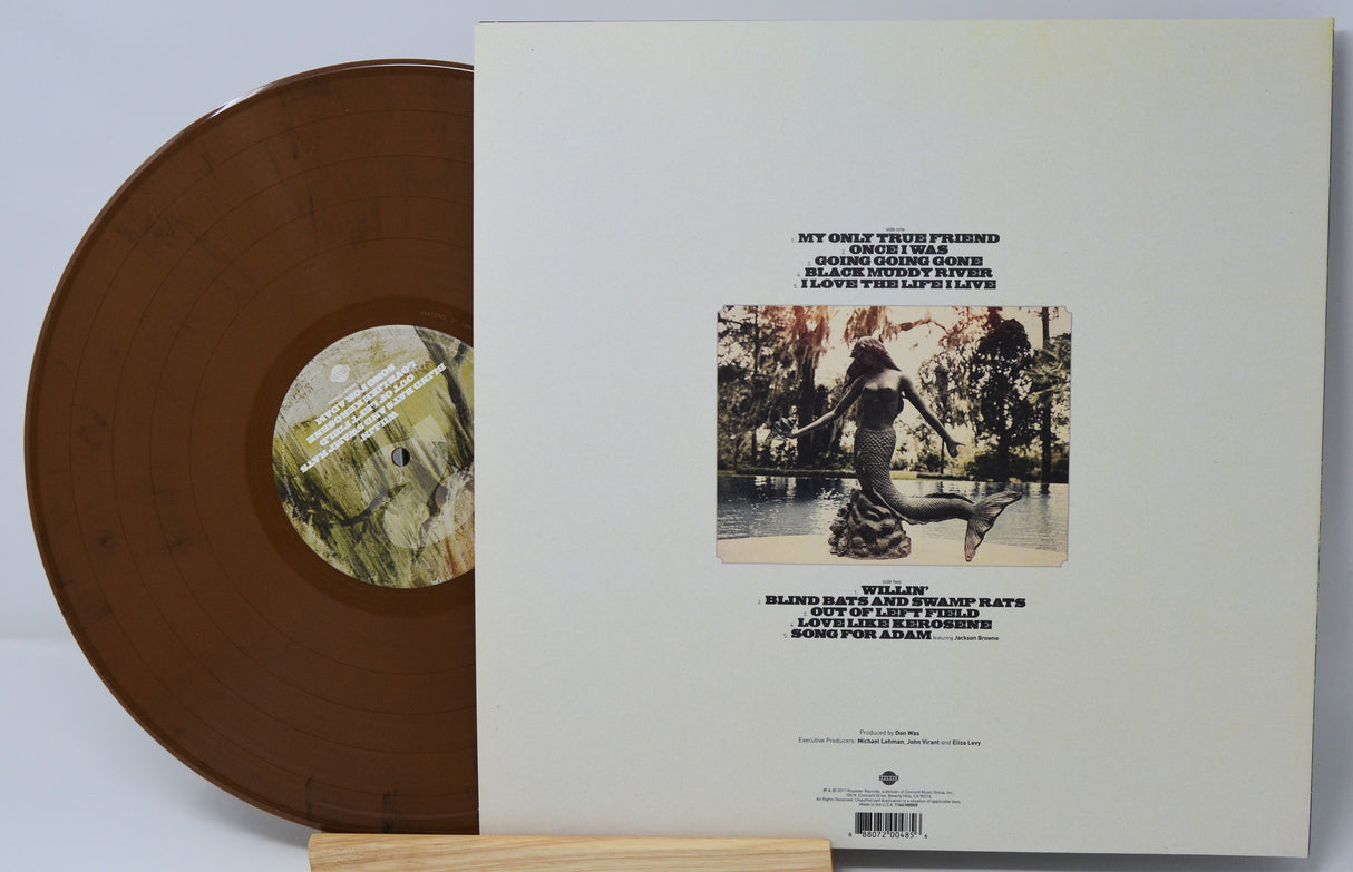 Brown vinyl record with a matching sleeve featuring album artwork and text.