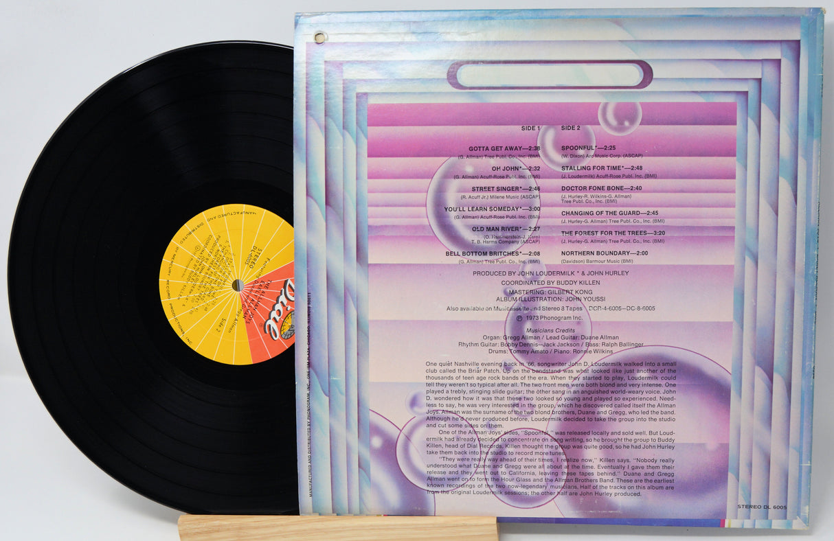 Vinyl record with a colorful cover featuring text and graphics.