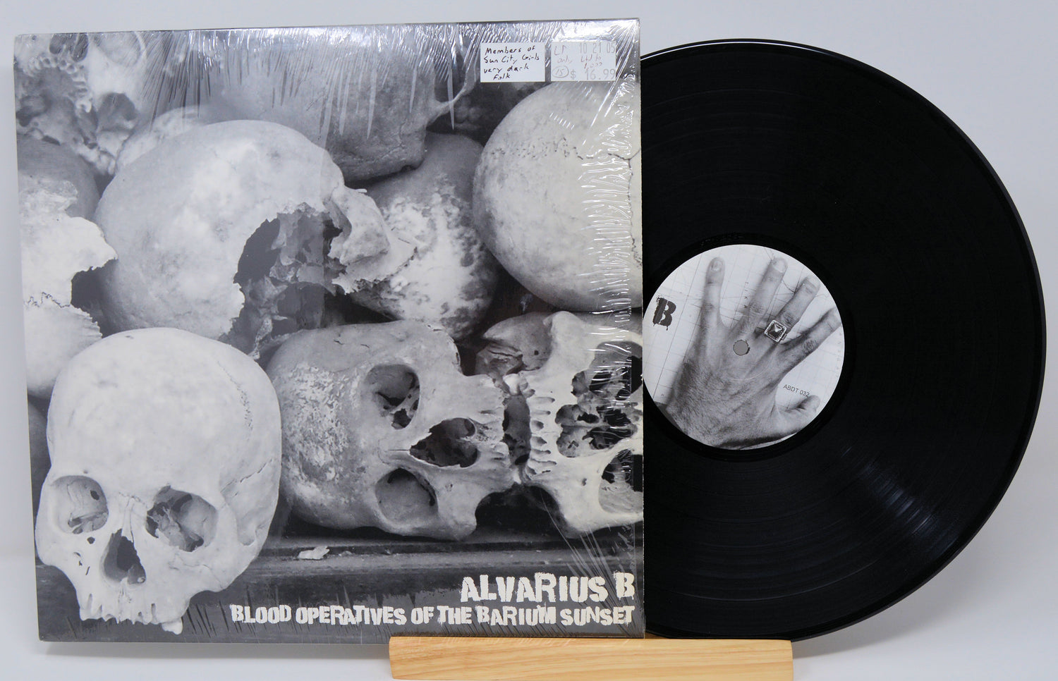 Vinyl record and cover art for Alvarius B album 'Blood Operatives Of The Barium Sunset' featuring a monochrome design with skulls.