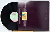 Vinyl record with cover featuring text and images on a white background