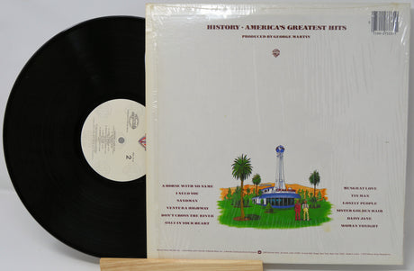 Vinyl record with cover featuring a scenic illustration and text on a white background