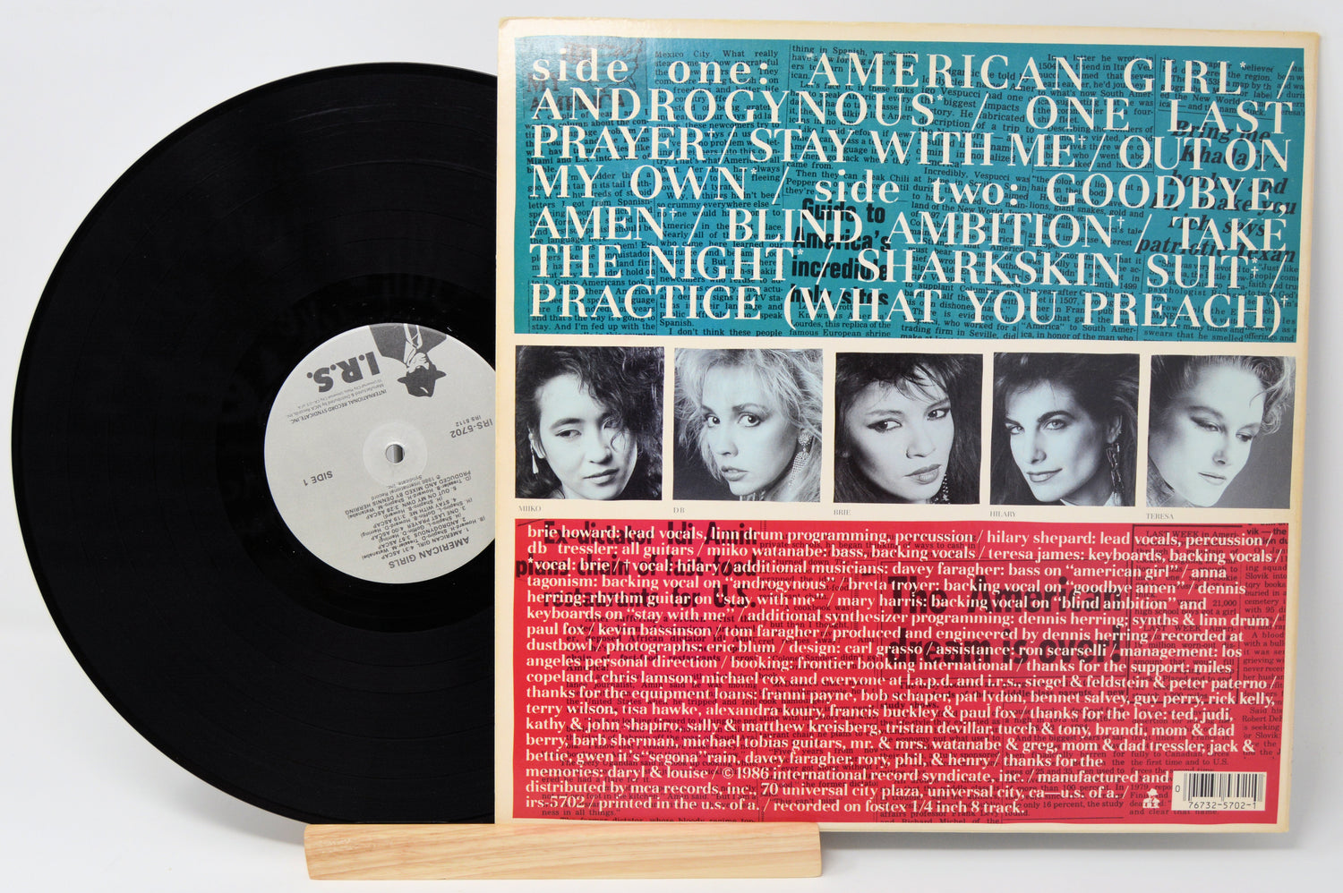 Used vinyl record of American Girls album with a photograph of the band members on the cover.