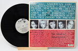 Used vinyl record of American Girls album with a photograph of the band members on the cover.