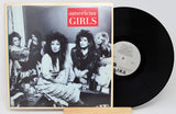 Used vinyl record of American Girls album with a photograph of the band members on the cover.
