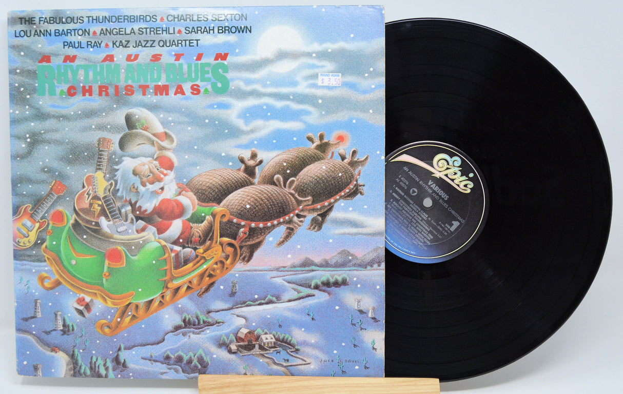 Front cover of 'An Austin Rhythm and Blues Christmas' vinyl record with illustrated Santa in a sleigh pulled by armadillos