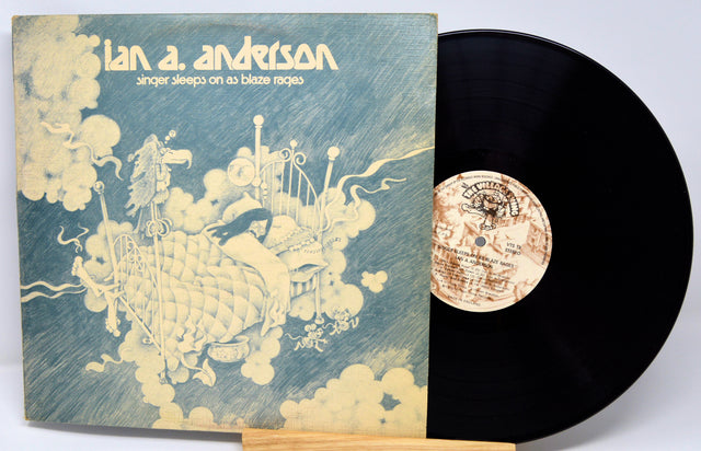 Vinyl record with cover featuring artistic design and text