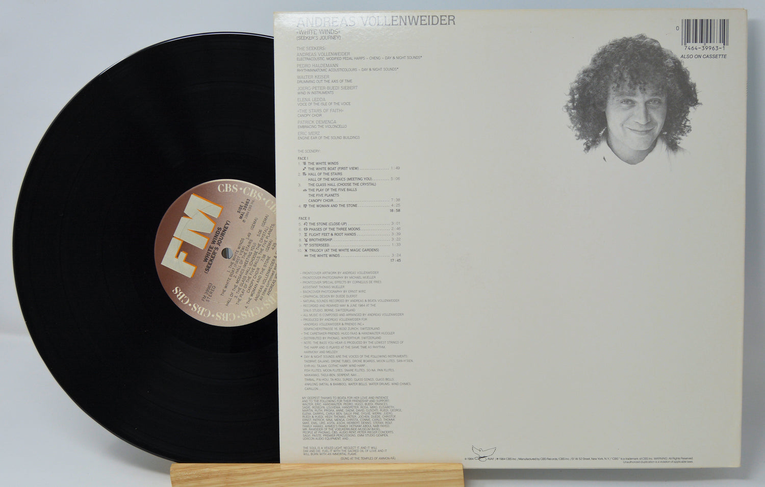 Vinyl record with cover featuring a person's face and text
