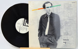 Vinyl record with a person on the cover and a white background