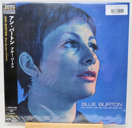 Ann Burton's 'Blue Burton' jazz album cover, featuring a blue-toned portrait of the artist on the front, with a black spine and Japanese text, displayed on a wooden stand.