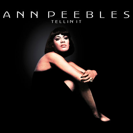 Album cover for Ann Peebles' 'Tellin It', featuring a dramatic portrait of the artist seated against a dark background with her name in large white text at the top.