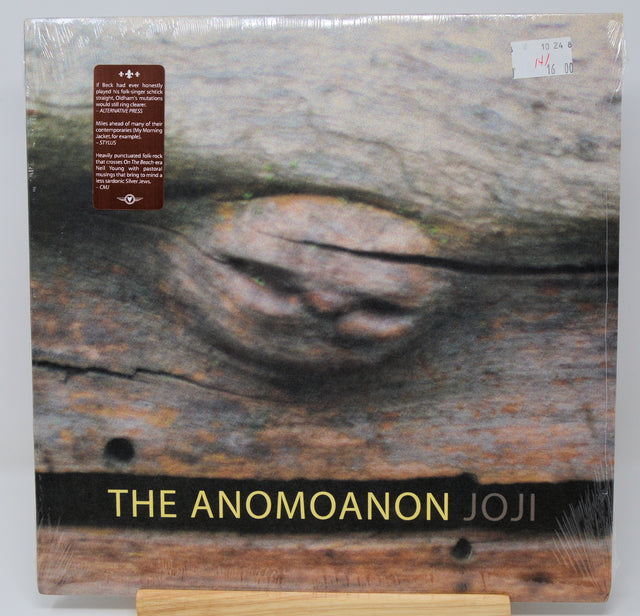 Vinyl record cover with the text 'THE ANOMOANON JOJI' prominently displayed, set against a textured background.