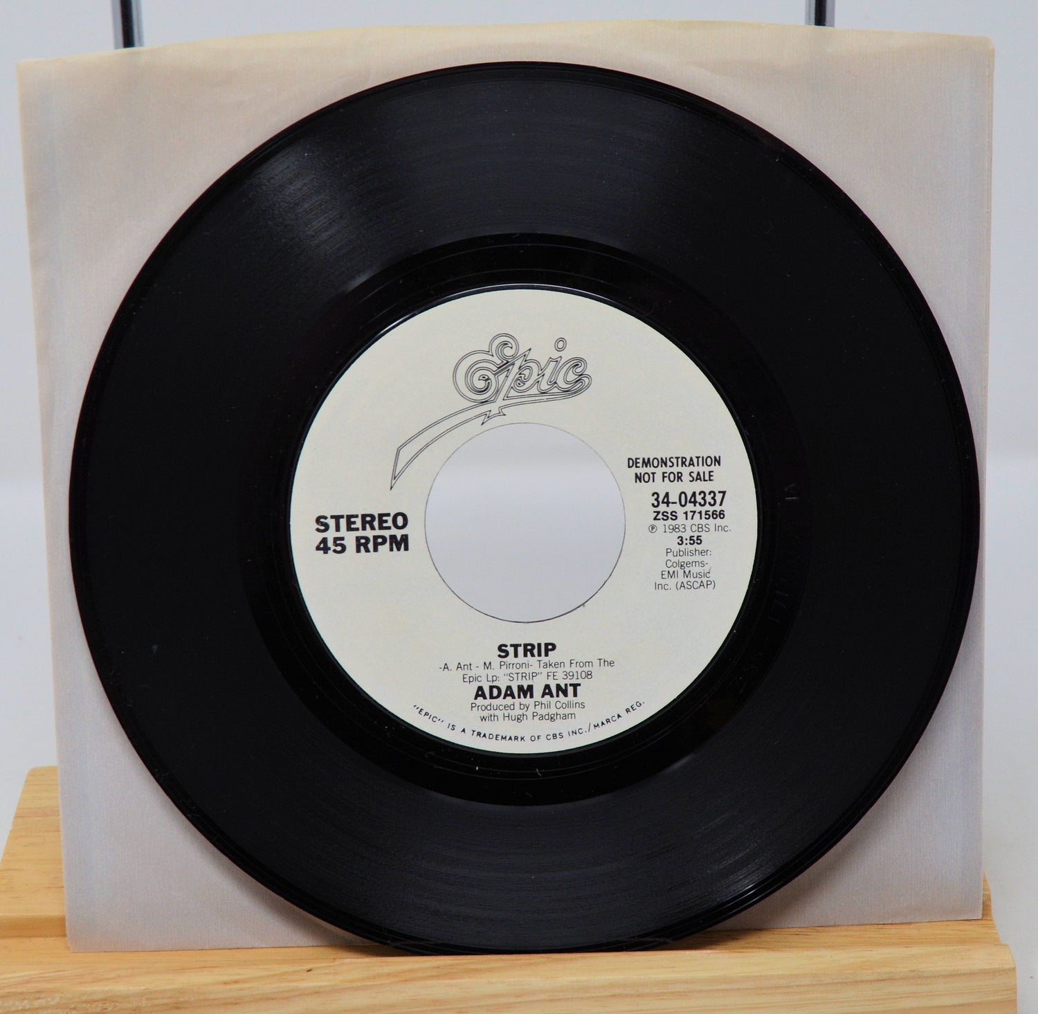 A vinyl record of Adam Ant - Strip with a 45 RPM speed label, demotional record, in a sleeve.