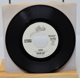 A vinyl record of Adam Ant - Strip with a 45 RPM speed label, demotional record, in a sleeve.