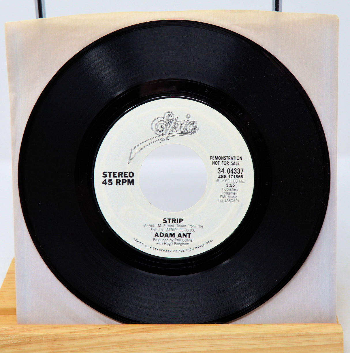 A vinyl record of Adam Ant - Strip with a 45 RPM speed label, demotional record, in a sleeve.