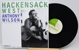 Vinyl record album cover for 'Hackensack West' by Anthony Wilson, shown with the black LP partially pulled out and a Cohearent label visible, on a light gray background.