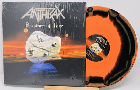 Vinyl record and cover for Anthrax's 'Persistence of Time' with a sunset design.